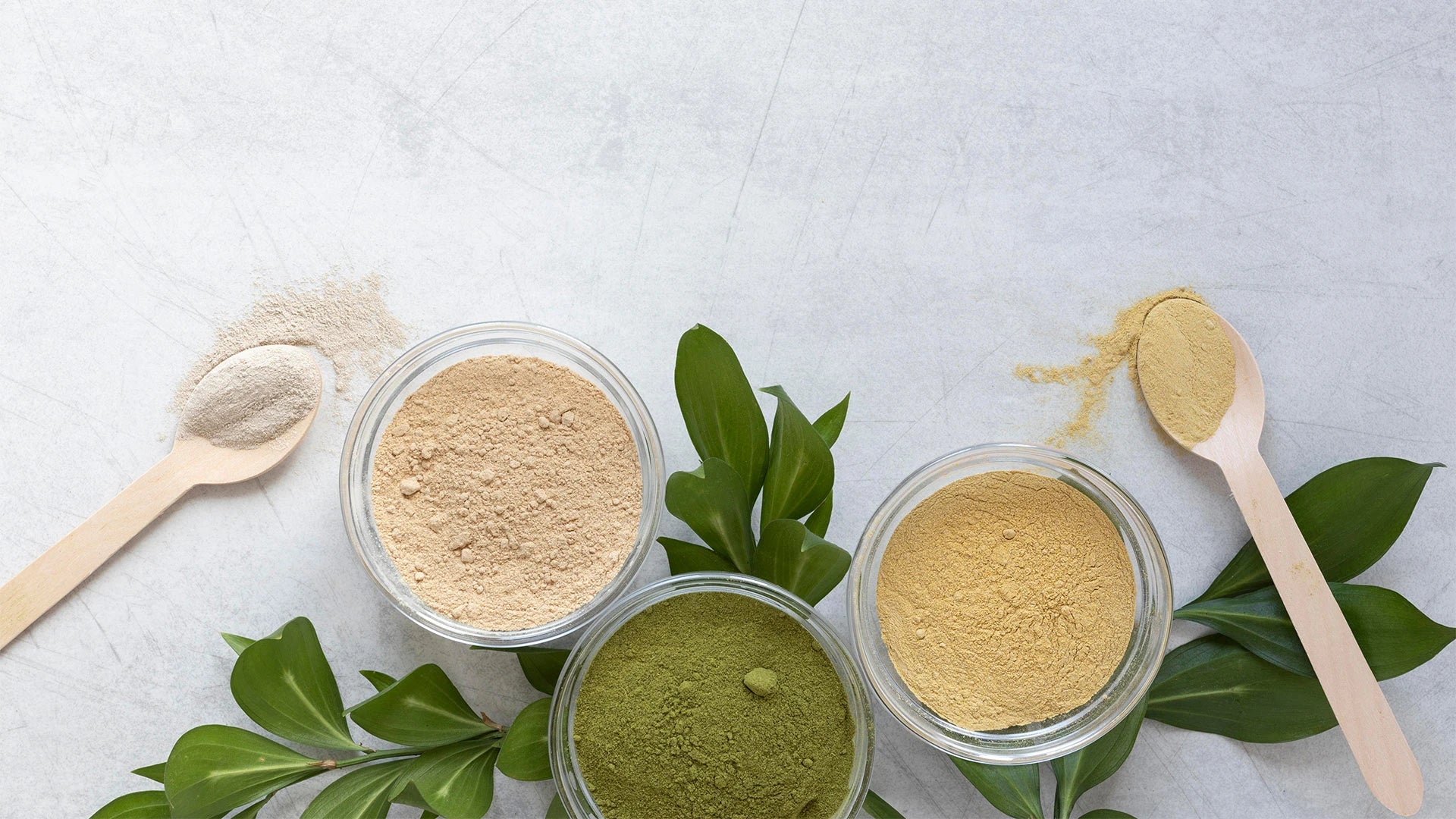 Bottle of neem oil with fresh neem leaves, highlighting its natural hair care benefits. 