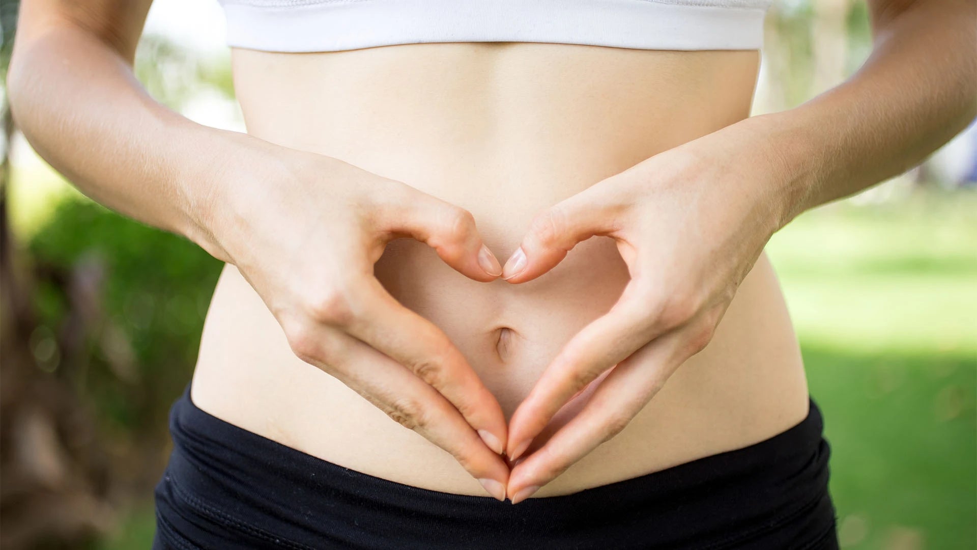 A woman feeling vibrant and healthy, representing natural female hormonal balance. 