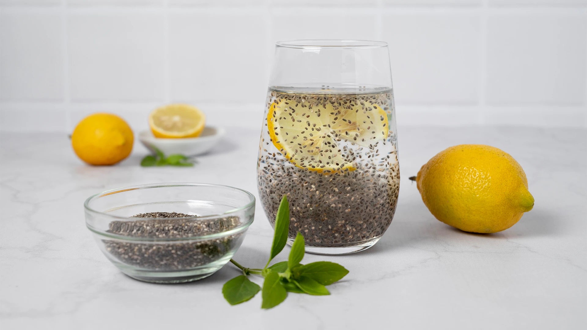 A collage of natural remedies for constipation including prunes, water, kiwi, and flaxseeds on a clean background. 