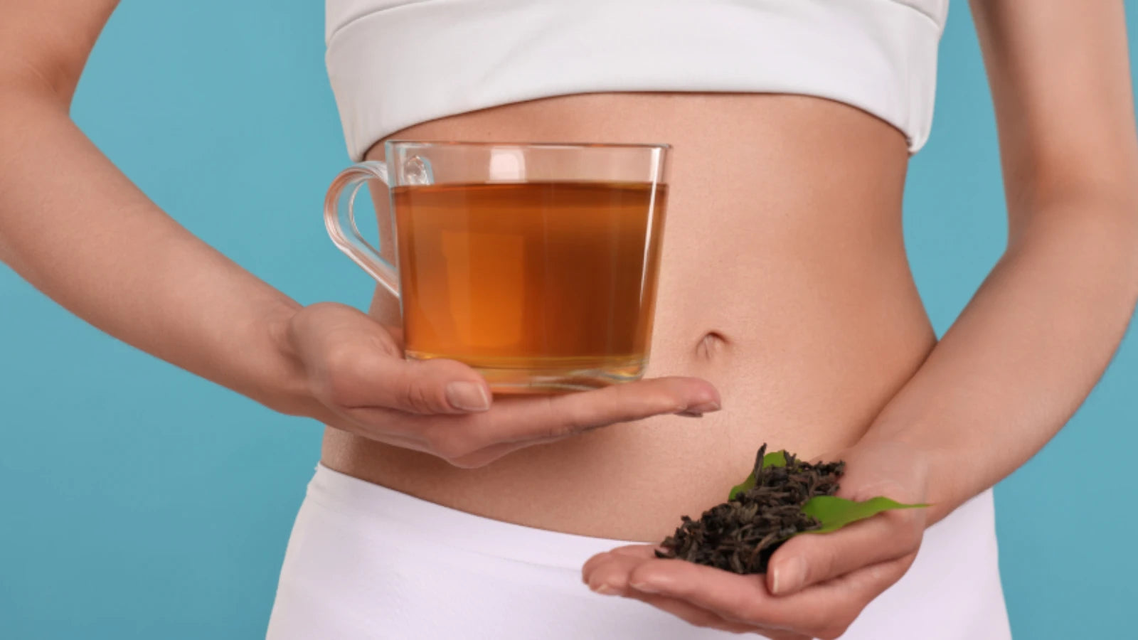 A glass of water next to a bowl of psyllium husk, representing fiber supplements for weight loss. 